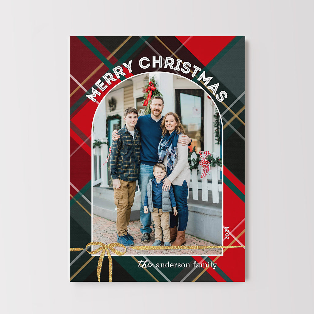 Christmas card with a family photo and plaid design on a white background