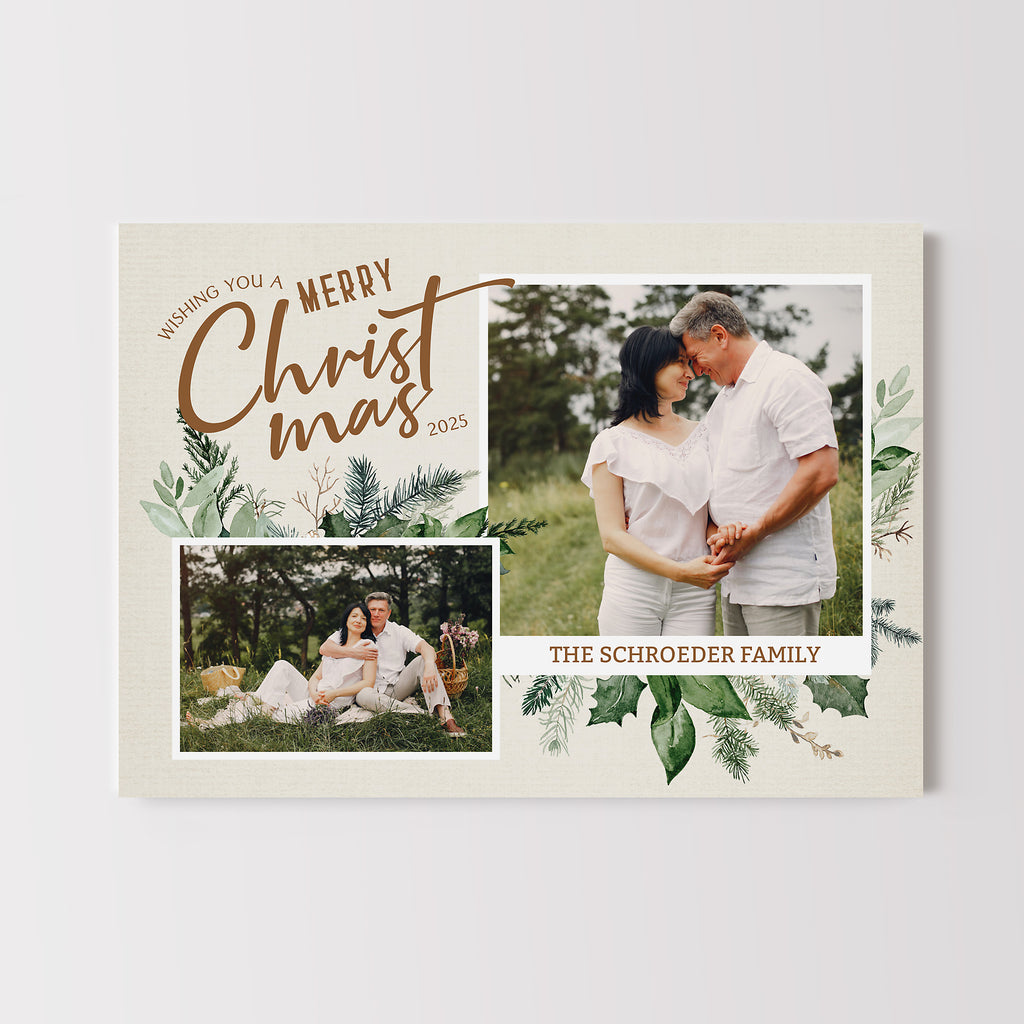 Elegant Christmas photo card with a neutral colored background and two photos framed by holiday greenery.