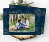 new year holiday photo card in landscape format with a single photo, blue background, gold text and white firework graphics