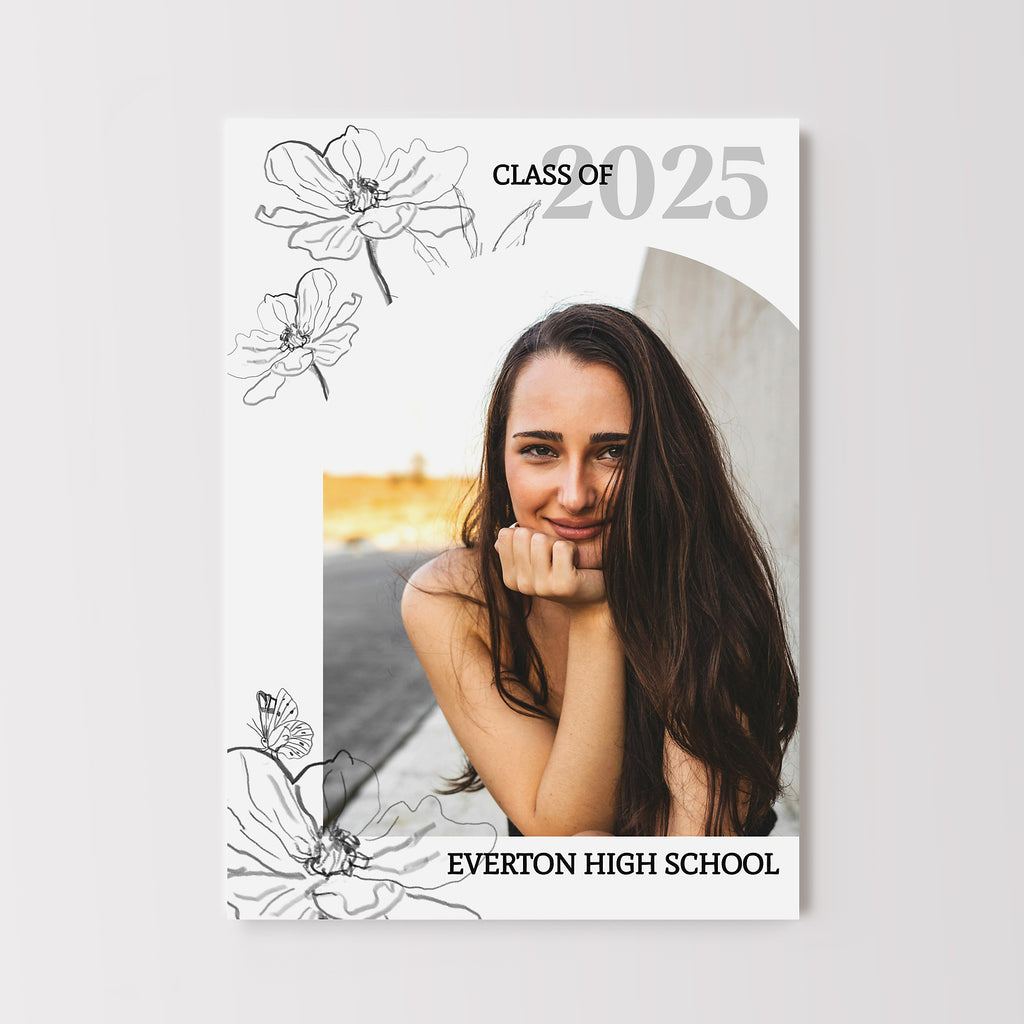 Graduation announcement with single arched photo, white background and black line drawn floral elements. 
