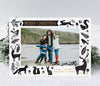 landscape oriented christmas card with a single photo on a white background framed by black folk style woodland animal graphics