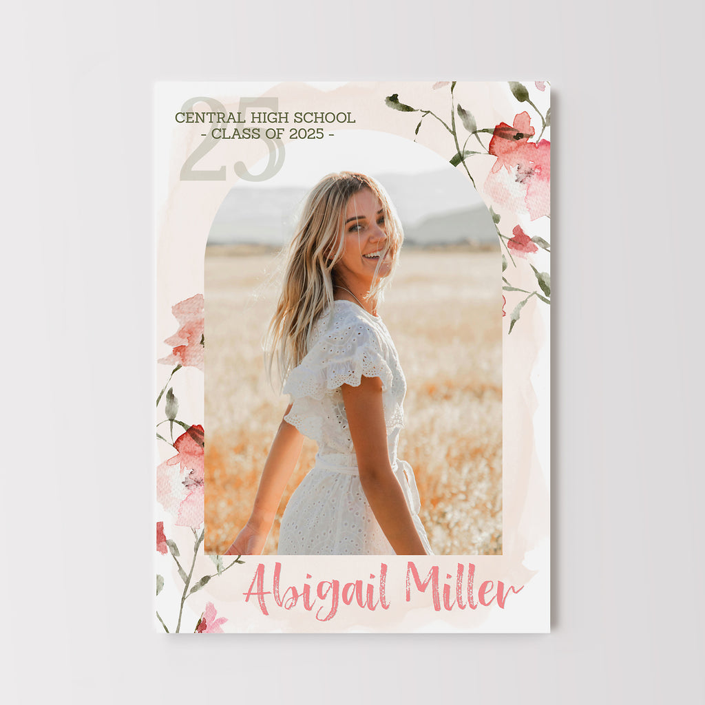 Girls graduation announcement template with an arched photo on a pink watercolor background with floral pattern.