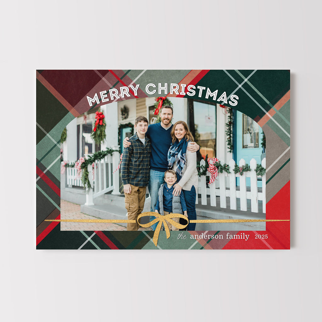 editable christmas card with a traditional plaid background, arched photo and gold ribbon detail