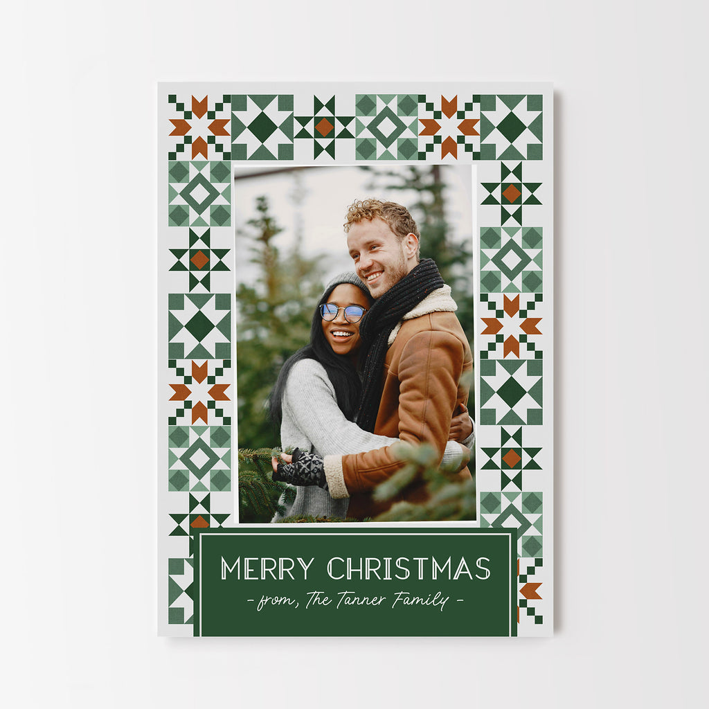 Vertical formatted Christmas card template with a single photo framed by a gold and green quilt pattern border and a green text box. 