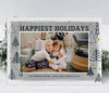 landscape oriented holiday card with a single photo framed by navy blue tree shapes against a gray and white watercolor 