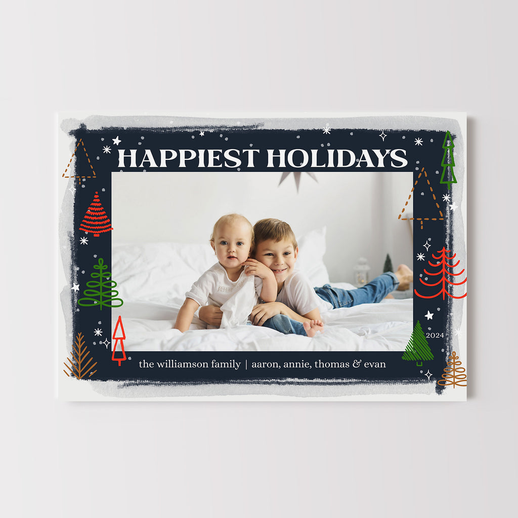Holiday card template with a single photo framed by navy blue and colorful abstract tiny tree graphics. 