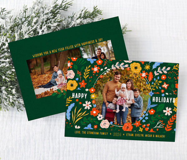 horizontal christmas or holiday card with a single circular photo framed with vintage floral graphics against a green background