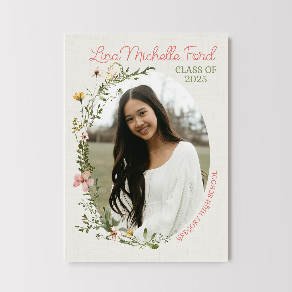 Graduation invitation with an oval photo framed by wildflower graphics. 